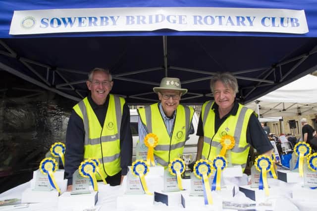 Rotary Club of Sowerby Bridge host Classic Bike and Scooter Show at Shire Cruises Wharf, Sowerby Bridge. From the left, Ian Slim, Richard Goodwin and president Alan Tatham.