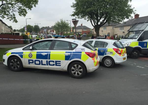 Police at the scene of a reported siege in Ovenden Way, Halifax