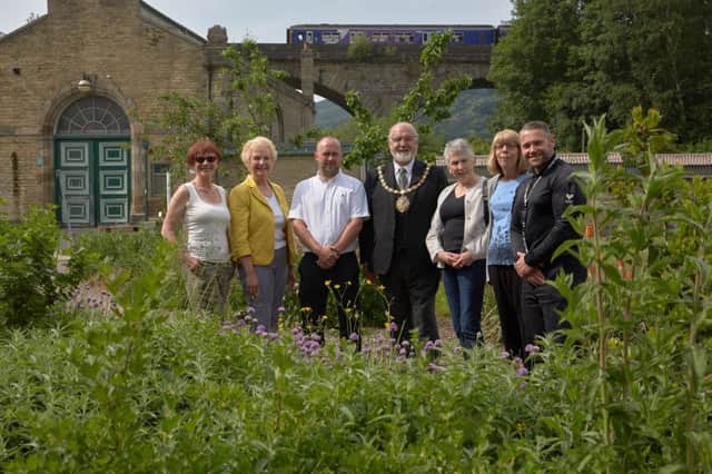 preparing for Todmorden Town Festival are Pam Warhurst, Cynthia Murray, Richard Carlton, Mayor Coun Tony Greenwood, Steph Booth, Lynne Houlden and Sgt Neil Taylor.