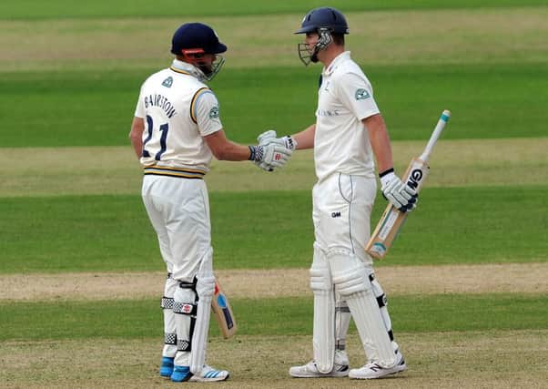 Yorkshire's Alex Lees (right) is congratulated on his fifty by Jonny Bairstow during the LV= County Championship match at Headingley, Leeds. PRESS ASSOCIATION Photo. Picture date: Tuesday September 23, 2014. See PA Story CRICKET Yorkshire. Photo credit should read: Anna Gowthorpe/PA Wire.