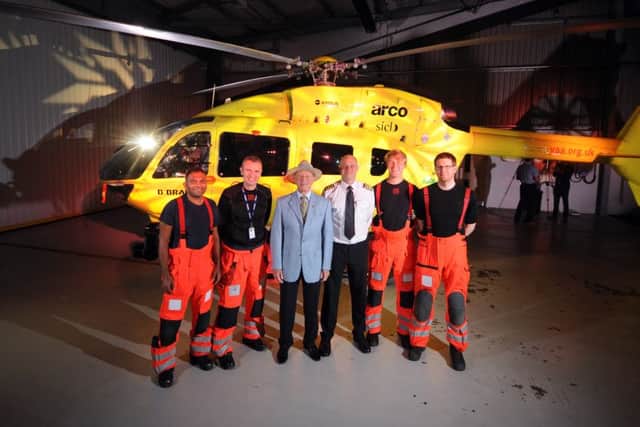 CPT Andy Lister and his tream pictured with Geoffrey Boycott by the new State of the art Helicopter, at the Yorkshire Air Ambulance Nostell Air Support Unit, Foulby, Wakefield...7th June 2016 ..Picture by Simon Hulme