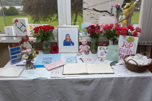 Flowers and memorials to Beth Fitton at Calder High School.