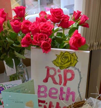 Flowers and memorials to Beth Fitton at Calder High School.
