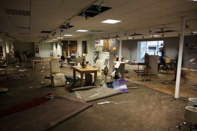 Mytholmroyd Flood. Devastation at Russell Dean's showroom.