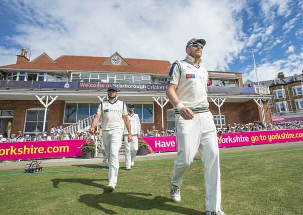 On North Marine parade: Captain Andrew Gale leading the Yorkshire team out against Durham at Scarborough last year.