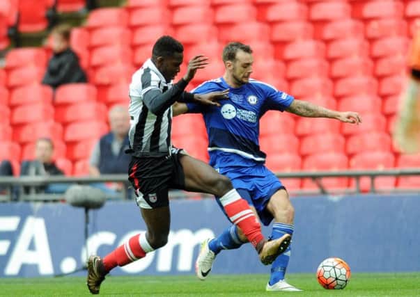 The FA Trophy Final.
FC Halifax v Grimsby Town.
Halifax's Richard Peniket takes on Grimsby's Aristote Nsiala.
22nd May 2016.
Picture : Jonathan Gawthorpe