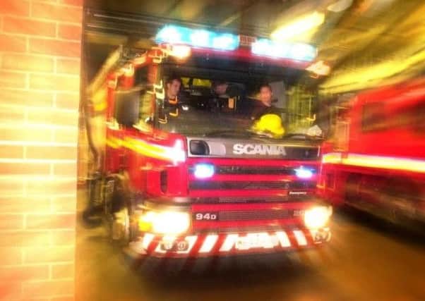 A woman was rescued by fire crews after a crash in Rastrick.