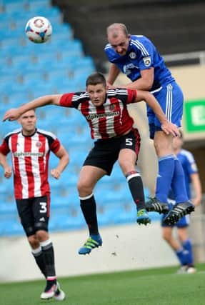 Tom Denton beats Jack O'Connell to a high ball.
FC Halifax Town v Sheffield United.  Pre-season friendly.  19 July 2016. Picture Bruce Rollinson