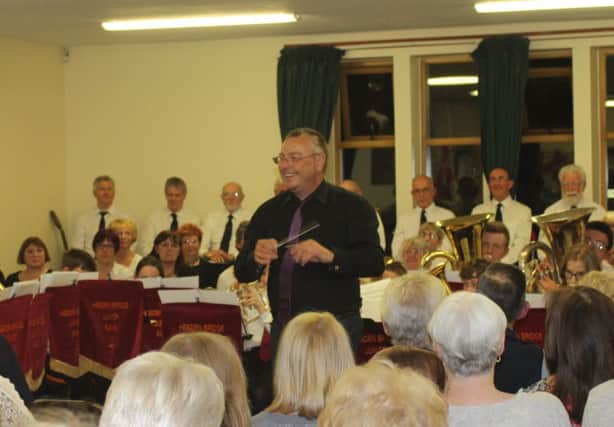 Musical director Neil proudly leading the band