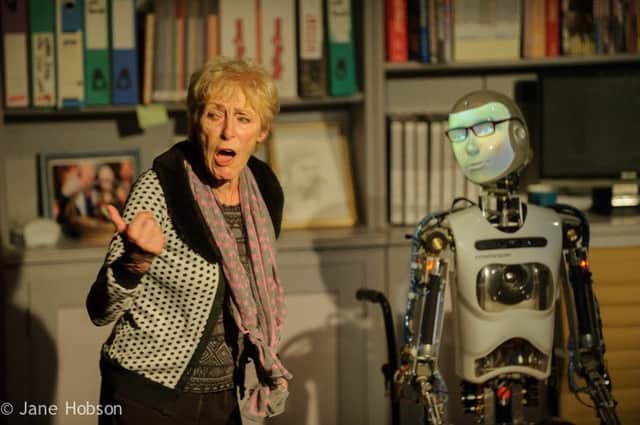 Edinburgh, UK. 07.08.2015. Pipeline Theatre presents SPILLIKIN, at the Pleasance Dome, as part of the Edinburgh Festival Fringe.  Written and directed by Jon Welch, designed by Jude Munden and Alan Munden. Robot Maker, Will Jackson. The cast is: Helen Ryan (Sally), Anna Munden (Young Sally), Michael Tonkin-Jones (Raymond), Alan Munden (Jonas),  and Robothespian (Robot/Raybot). Â© Jane Hobson.