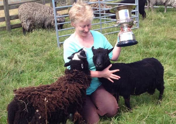 Julie Shearn with two of her winning flock
