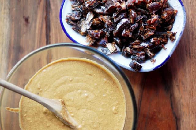 Stir the dates and walnuts into the mixture