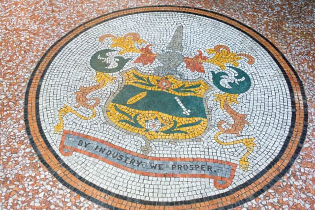The mosaic floor displaying the town crest at Todmorden Town Hall.