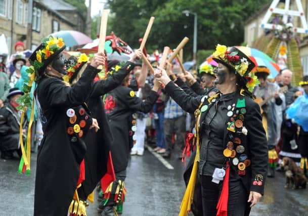3 September 2016.......   Dancers perform in Warley Village as the Sowerby Bridge Rushbearing Festival passes through. 
The festival over two days is a huge procession of morris dancers, musicians, mummers and a 16 ft tall rush cart hauled by 60 men around pubs and churches in the Ryburn Valley and is the only one of its kind in Yorkshire.
It celebrates a 17th century tradition where villages came together to lay fresh rushes on local church floors. Picture Tony Johnson.