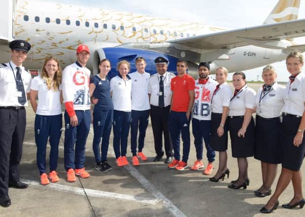 Yorkshire Olympic athletes, l-r, Vicky Holland, Gordon Benson, Laura Weightman, Non Stanford, Tom Bosworth, Muhammed Ali and Qais Ashfaq poses with the British Airways crew after landing at Leeds Bradford Airport.

Photograph by Richard Walker/ www.imagenorth.net
