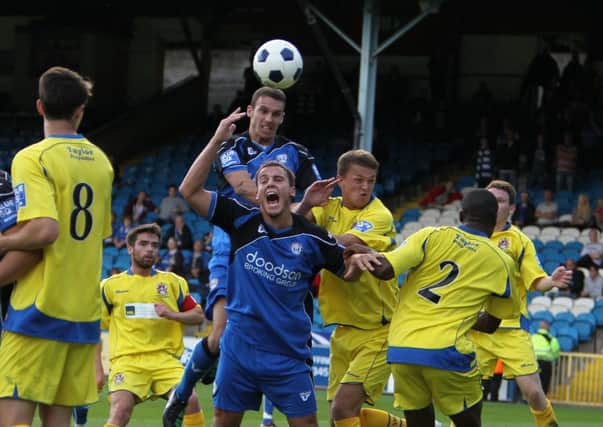 Actions from the game FC Halifax Town v Stalybridge Celtic at the Shay, Halifax
Pictured is Danny Holland and Lian Hogan (above)