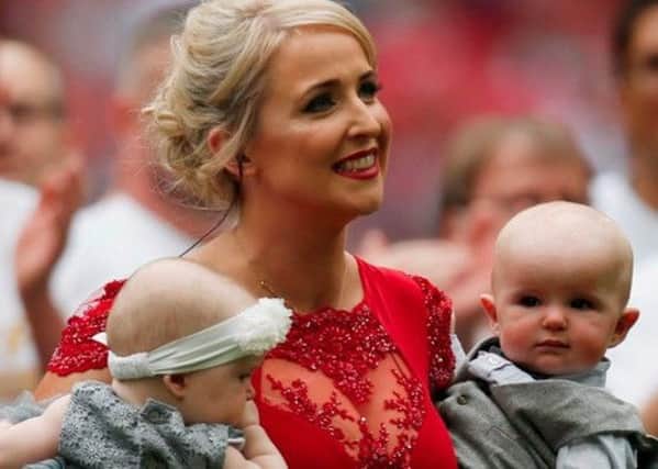 Lizzie Jones after performing at the Champion Cup Final with her children