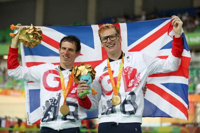 Great Britain's Steve Bate (right) and pilot Adam Duggleby celebrate on the podium after winning gold in the Men's B 4000m Individual Pursuit  Andrew Matthews/PA Wire.