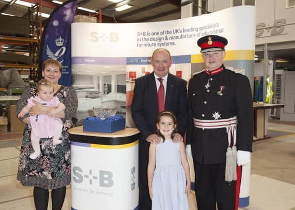 Paul Bentham and his wife Renata, with two children Erica and baby Emilia who are residents of Ripponden, pictured with The Lord Lieutenant of Manchester.