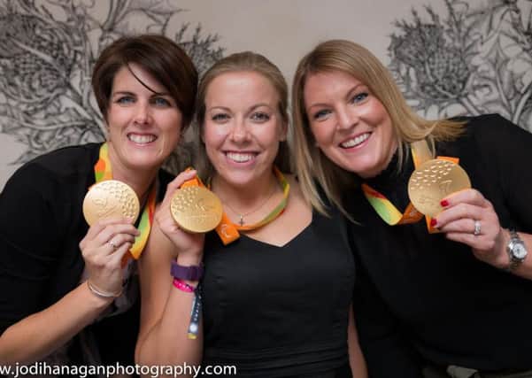 Hannah (centre) poses with her trio of gold medals with Caravan Guard
director Louise Menzies (right) and PR & Communications Manager Liz Harrison (left)