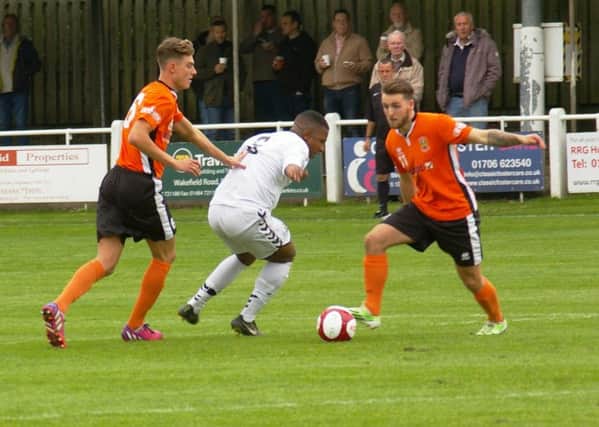 stalemate: Brighouse Towns Luke Parkin tries to get an attack going in Saturdays clash against Mossley.