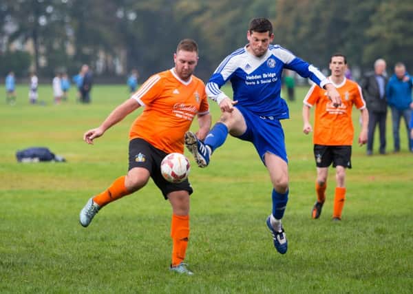 Actions from the game, King Cross Park v Hollins Holme, at Savile Park. Pictured is Martin Chittock and Andy Butterworth