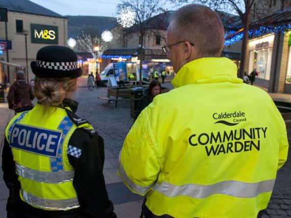 Police and a Calderdale Council Community Warden patrollling Halifax town centre