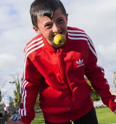 Fun day and football fundraiser im memory of Alex Steele at Elland Cricket Club. Scott Firth, 11, bobs for an apple.