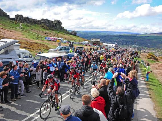 The peloton of the Tour de Yorkshire make their way through the crowds on the Cow and Calf in Ilkley on Stage 3. TJ100823i Picture by Tony Johnson
