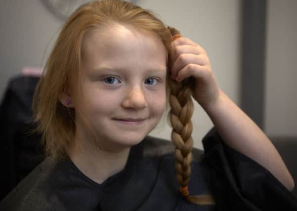 Grace Sirmond, aged nine, has donated her hair to the Little Princess Trust.