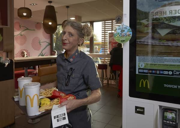 Glenda Danks waits on tables at McDonalds, Salterhebble, Halifax.