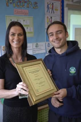 Laura Cook and James Chadwick with their award at Withinfields School, Southowram.