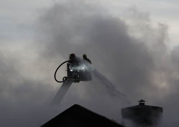 Fire crews tackle a blaze in Gas Works Lane, Elland. Photograph by Steve Midgley