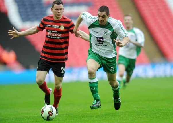 FA Trophy Final at Wembley Stadium.
North Ferriby United v Wrexham.
Ferriby's Danny Clarke gets away from Wrexham's Connor Jennings.
29th March 2015.
Picture Jonathan Gawthorpe.