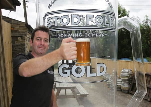 Angus Wood at the Stod Fold Brewing Company, Ogden prepares for the world record attempt for world's largest glass of beer.