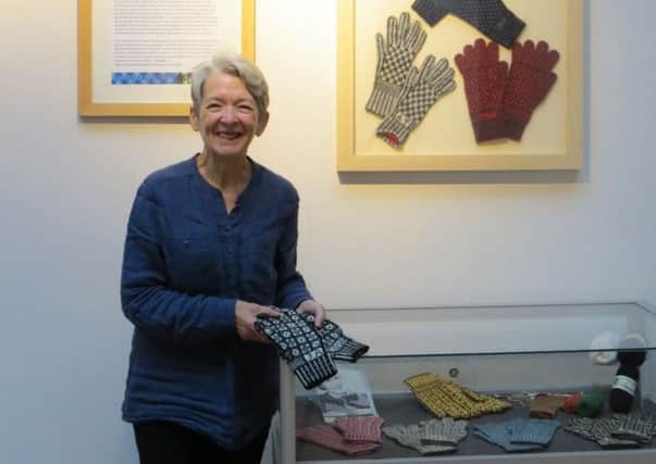Designer Angharad Thomas with her Hand in Glove exhibition