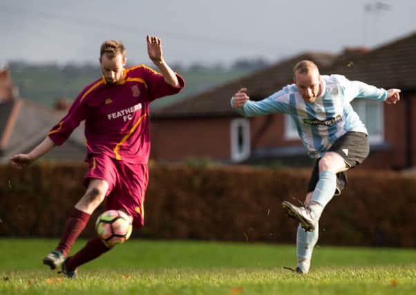 Actions from the game, Feathers FC v Waiters Arms, at Mytholmroyd. Pictured is Richard Veal and Dean Park
