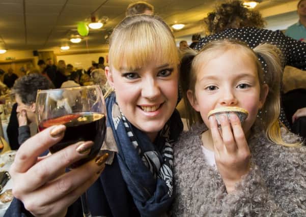 Fundraiser at Lightcliffe Golf Club in aid of Bloodwise by Bretts Hairdressing. Mulled wine and mince pies - mum Philippa Kermotschuk with Phoebe Kermotschuk, six.