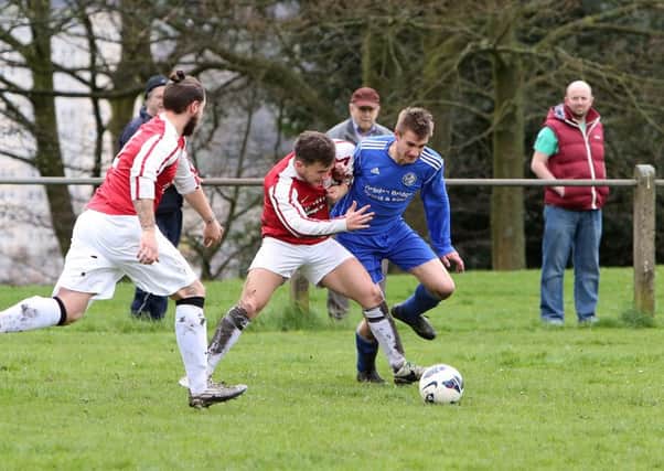 Sunday football - Queen's Head (red) v Hollins Holme (blue).
Simon Coffey for Queen's Head and George Bamford for Hollins Holme.