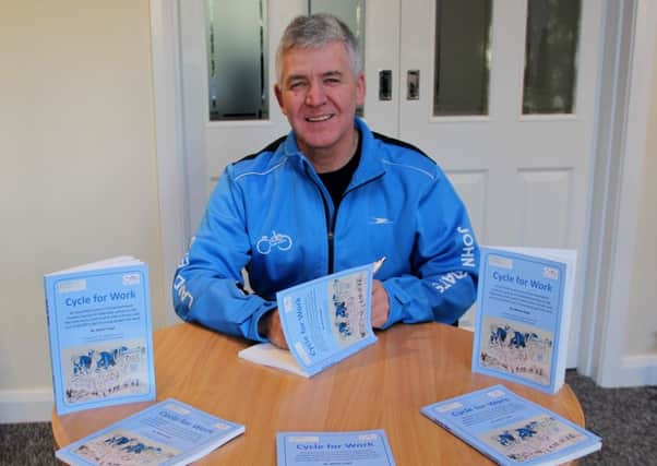 Martin Haigh with copies of his book