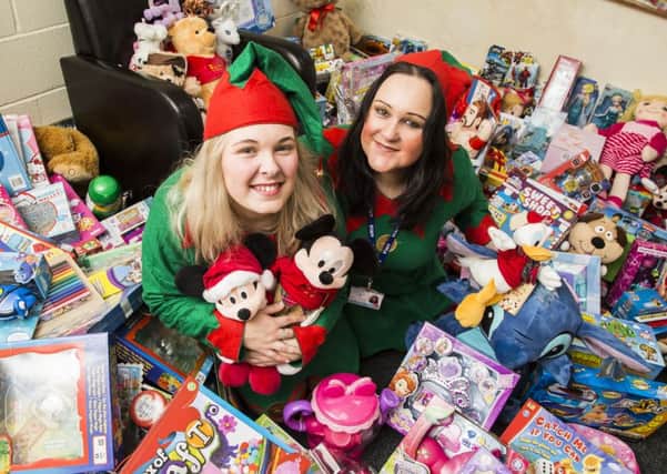 Sophie-Anna Middleton, left, and Sarah Thompson at the Yorkshire Children's Trust Christmas present give-away.