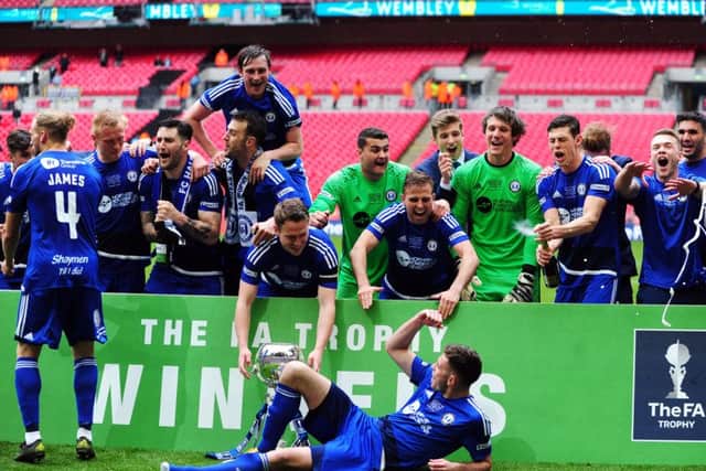 The FA Trophy Final.
FC Halifax v Grimsby Town.
Halifax players celebrate.
22nd May 2016.
Picture : Jonathan Gawthorpe