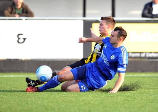 15 October 2016....... Harrogate Town v Halifax Town, FA Cup 4th qualifying round.
Harrogate's Lewis Turner and Halifax captain Liam King challenge.  Picture Tony Johnson.