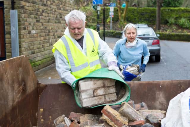 Clean up of the ground floor, at the Trades Club by Unite Community and friends, following the floods of 2015 Hebden Bridge. Pictured are coun Steve Sweeney and Alice Barford