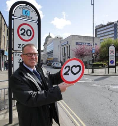 Calderdale Council is introducing blanket 20mph zone across Halifax town centre and elsehwre in Calderdale as part of a Love Our Streets campaign. Paul Butcher with the new signs.