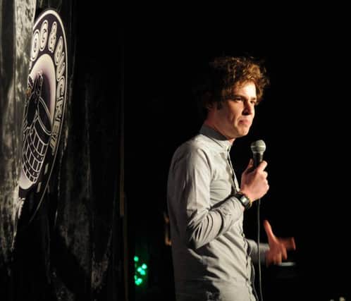 PHOTO. KEVIN McGUINNESS.
Brennan Reece on stage at The Frog and Bucket Comedy Club, Preston