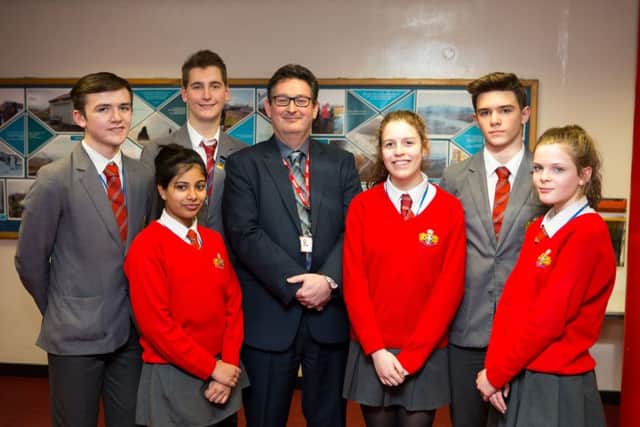 Principal Andrew Fisher, with students at North Halifax Grammar,  top of the GCSE school league table in Calderdale