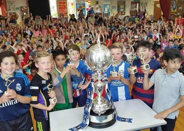 Pupils at St Mary's Catholic Primary School with the FA Trophy. Picture: Darren Murphy