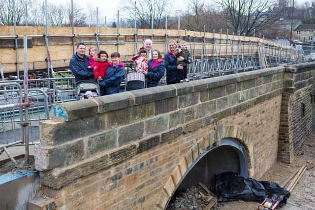 The footpath is open again on Elland Bridge, Elland, after the Boxing Day 2015 floods. Pictured are children and carers from the Waters Edge Nursery Ltd, whp also suffered in the floods.