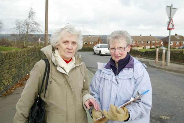 Brighouse Road Safety Committee campaigning to have chicanes removed from stretch of road outside Withinfields Primary school, Southowram
Pictured with the petition from 200 local residents, (from left) are:- vice-chair, Pat Oates and chairperson,
Ann Rutherford